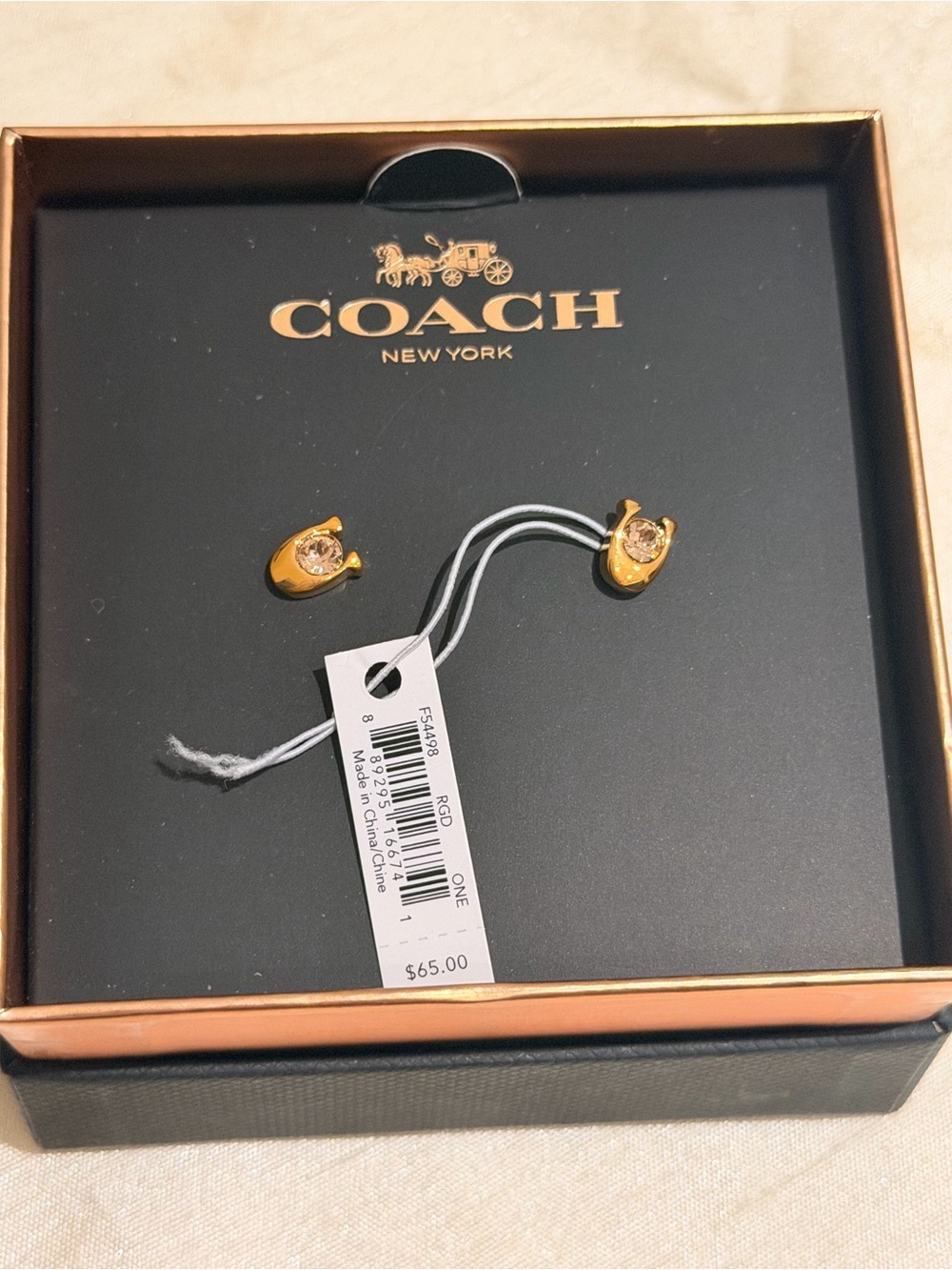 Coach earnings rose gold color, new inbox